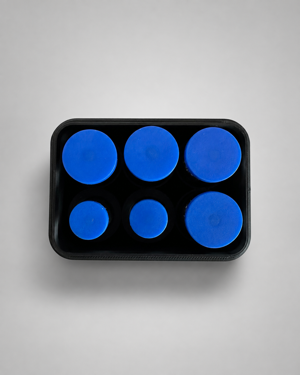 Top view of six vials in the storage case tray