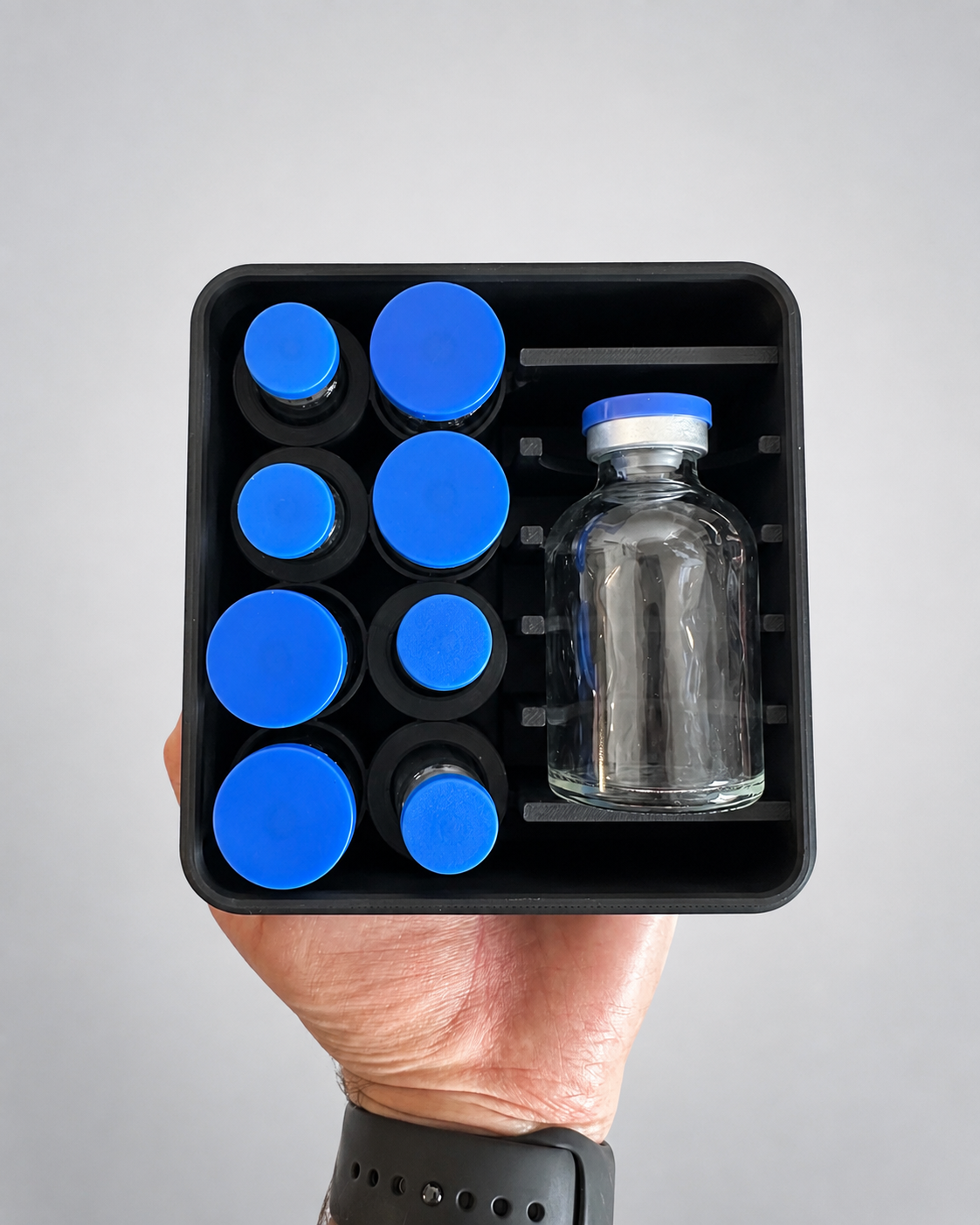 8-vial plus large bottle storage case shown from above in hand